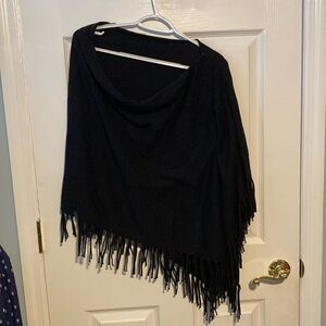 Black off shoulder poncho. No damages.